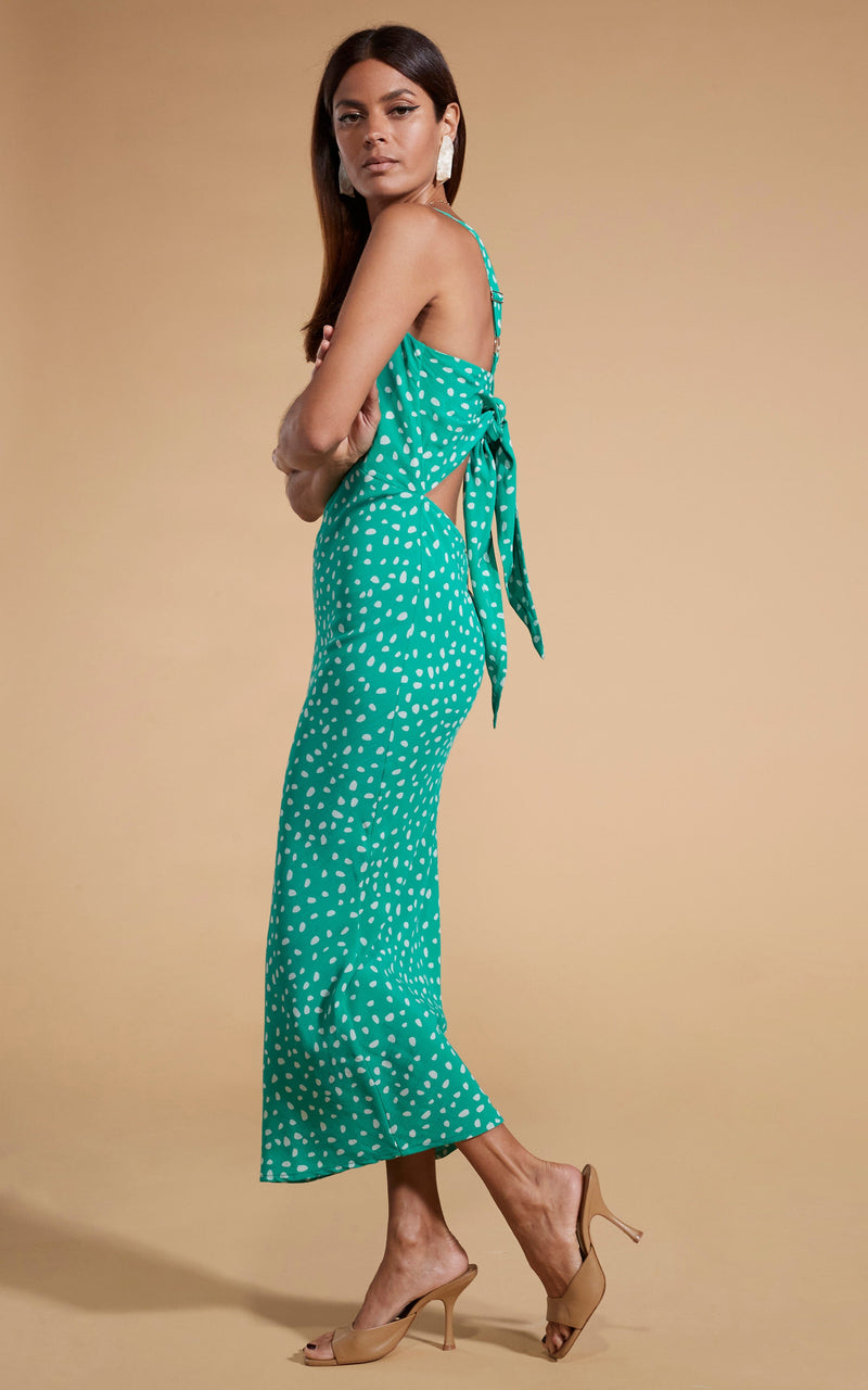 Dancing Leopard model wearing Sabrina Midaxi Dress in Odd Dot White on Sea Green facing side on